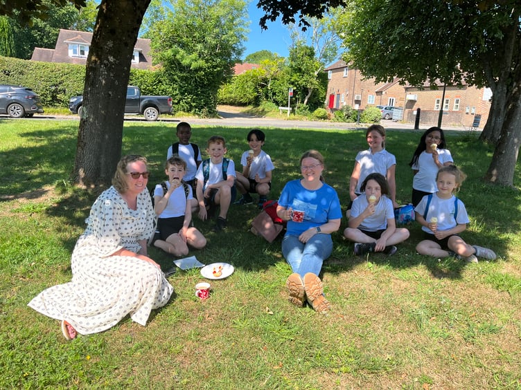 Villagers enjoy a cream tea in the sunshine at the Fernhurst Hub’s annual summer gathering