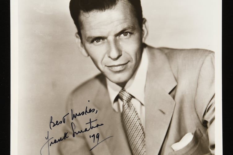 An autographed picture of Frank Sinatra.