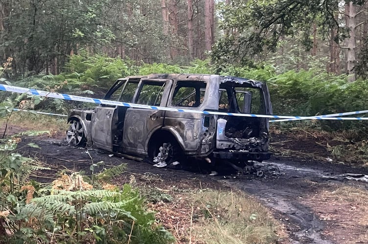 Burned car wreckage Longmoor Bordon
