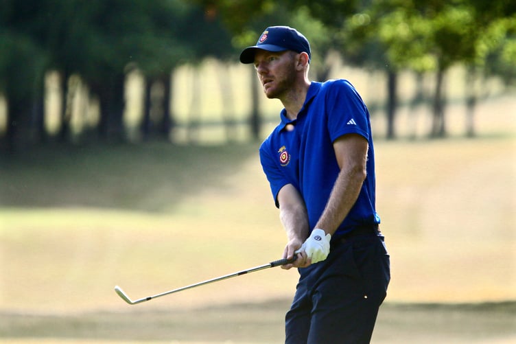 Liphook's George Saunders chips on to the eighth green in the second round of the South East Qualifier (Photo: Andrew Griffin/AMG PICTURES)