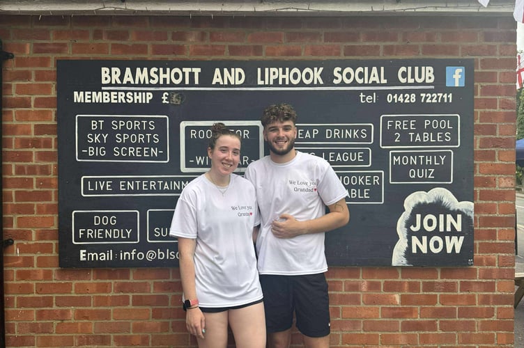 Tash and Jake Cunningham cross the finish line, completing their half-marathon in memory of their grandfather, Mick the Brick