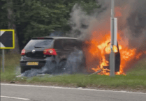A31 shut as firefighters deal with car blaze