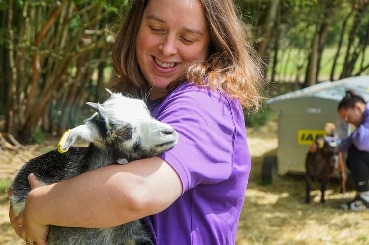 Girl and goat.