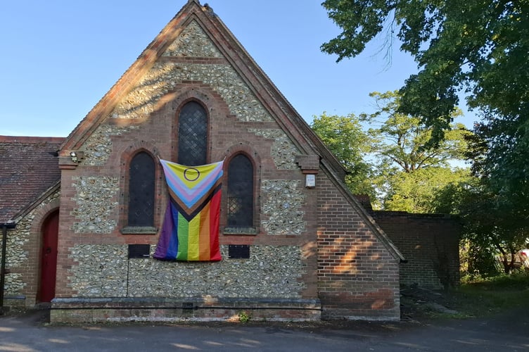 St Mark's Church in Hale displays its Pride flag in the summer of 2025.