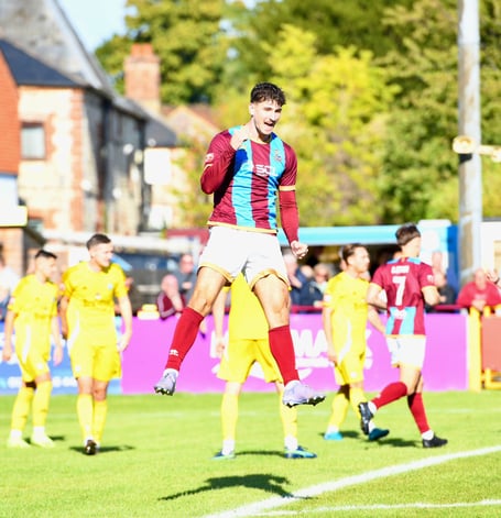 Sam Evans celebrates after scoring Farnham Town's second goal