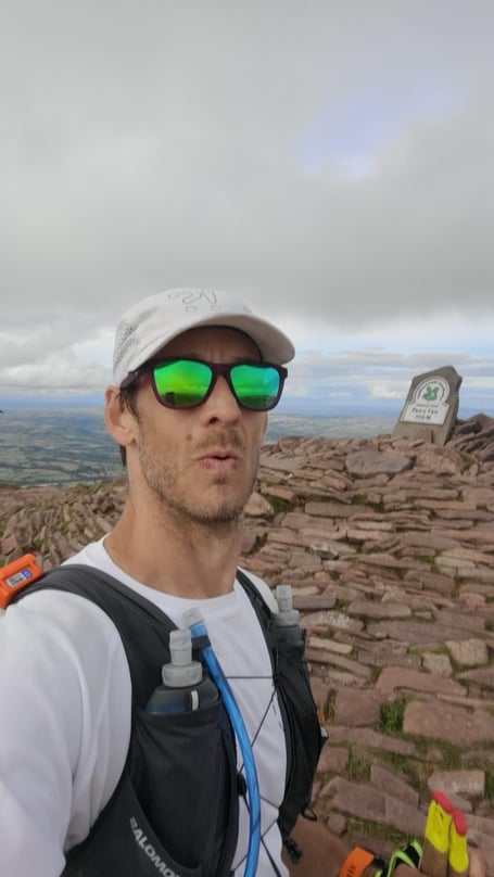 Adam Wade reaches the summit of Pen y Fan