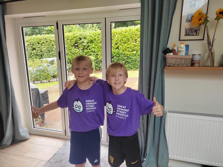 George and Arlo, both ten, after completing one of their daily runs for Great Ormond Street Hospital