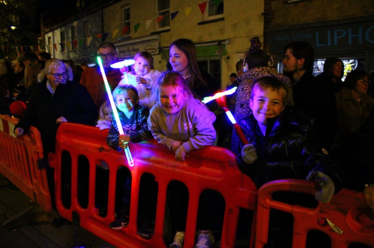 Crowds line the streets as the 124th Liphook Carnival parade lights up the village
