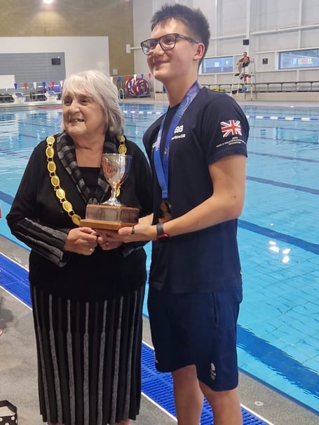 Ranjou Tomblin being presented the Napier Trophy by Hampshire Artistic Swimming Association president Janet Selley