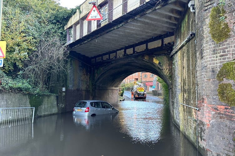 Cars stranded and shop staff sweeping out water as flash flooding returns to Haslemere