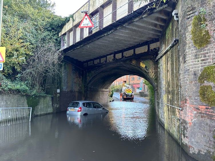 Cars stranded and shop staff sweeping out water as flash flooding returns to Haslemere