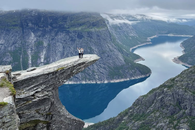 Minna Havstad and husband Andy with daughter Malva on their travels. A couple split their parenting duties on flights by buying one ticket in business class and one in economy - and say it makes them "better parents".Keen globetrotters Minna Havstad and husband Andy, both 34, used to find themselves exhausted when they took long-haul flights with daughter Malva, now three.They said Malva's wriggling, coupled with their baggage, snacks and toilet trips, would mean none of them got a wink of sleep and it would make the first day of their holiday extremely tough.So they had the idea to book one seat in business class, and the other in economy alongside a seat for Malva - and they would swap at the halfway point, so each parent got a few hours' peace.After trialling the idea using their flight points to upgrade, the parents said it revolutionised their flights - and they've done it several times since.