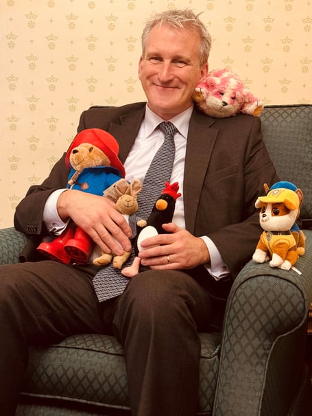 Damian Hinds MP with some children's toys.