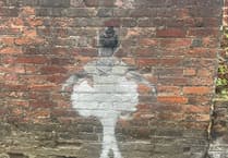 Mystery street artwork appears on wall in Farnham