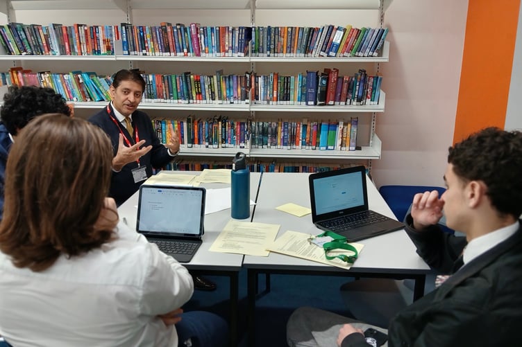 Khalil Yousuf discusses public speaking with students.