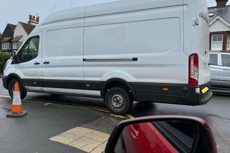 A transit van with its numberplate obscured parked on The Ridgeway in Farnham
