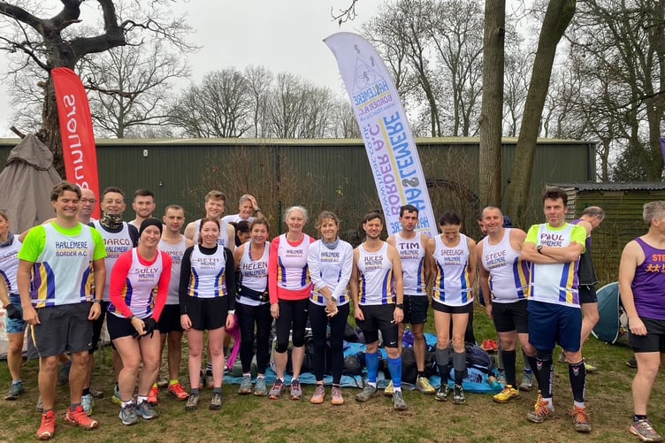 Haslemere Border Athletics Club line up for a team photo at the Lord Wandsworth cross country
