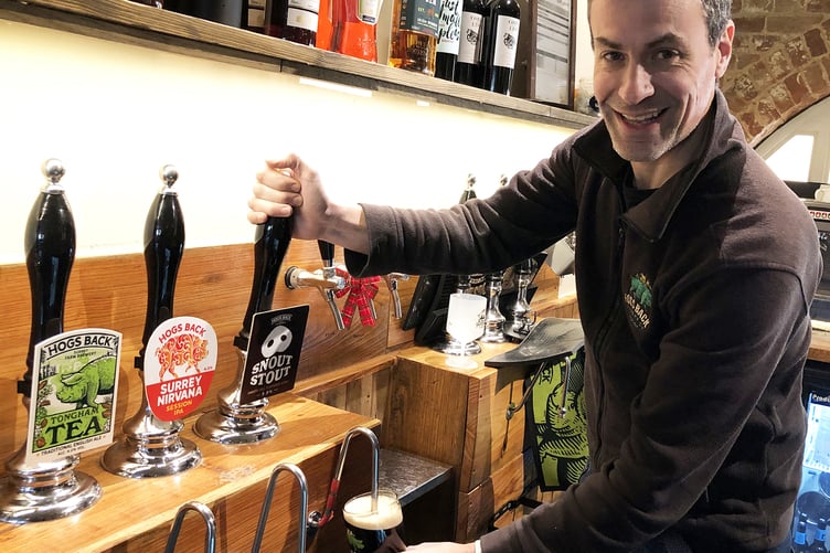 Hogs Back Brewery Managing Director Miles Chesterman pours a pint.