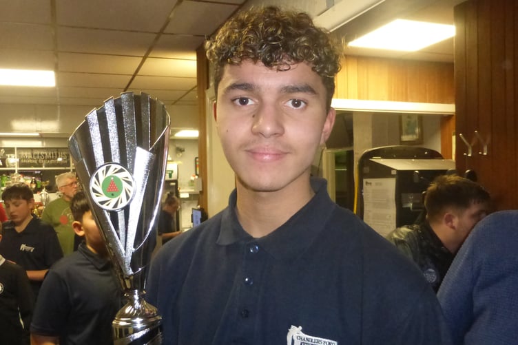 Bordon cueist Lewis Harris shows off his trophy