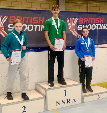 Jamie Neatherway (centre) finished first in the South East Region Schools' Pistol Championships