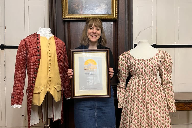 Farnham Museum Manager Lauren Wayland with the Museum Accreditation Scheme award.