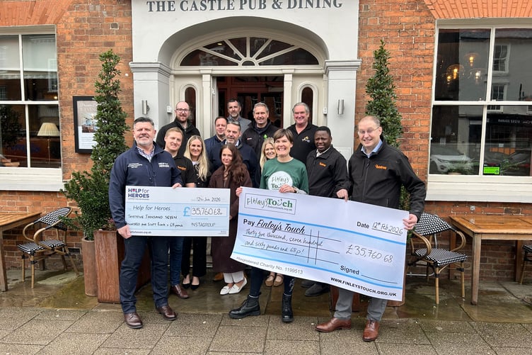 The New Dawn Pubs cheque presentation outside The Castle Pub in Farnham.