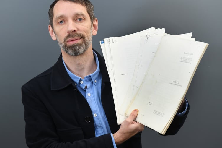 Auctioneer Andrew Ewbank with the papers charting the break-up of The Beatles.