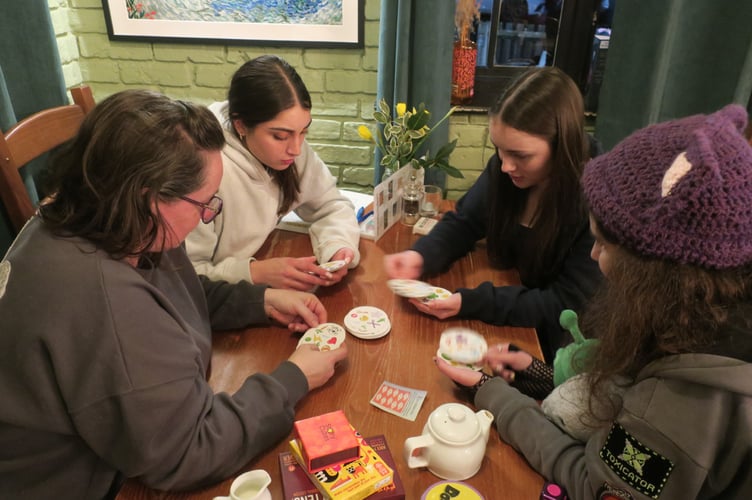 Attendees enjoying a screen-free evening of games and conversation at Beyond The Screen. Photo: Kim and Mike Jarred