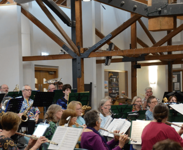 Audience gives great thanks for music of band and choir