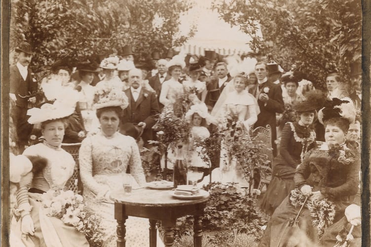 A wedding gathering believed to date from the early 20th century, possibly taken in Haslemere Garden. Credit: Johnny Bean