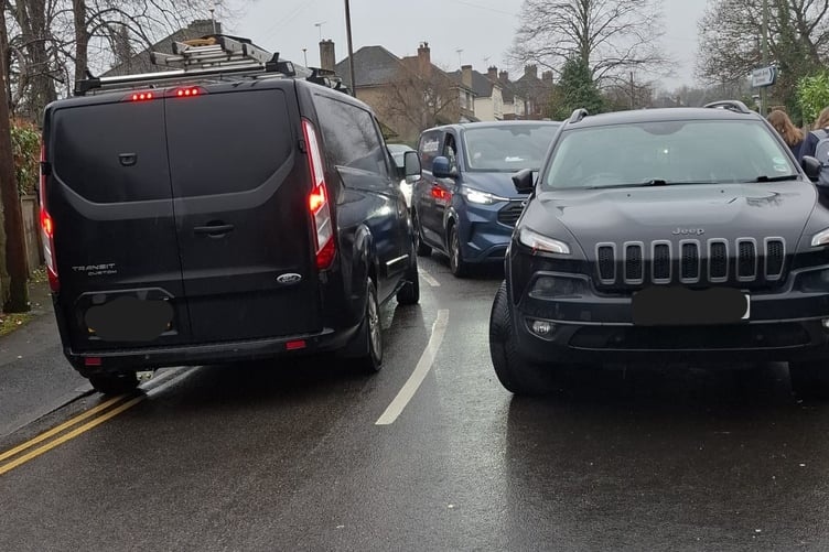 Cars trying to get in and out of Hale Reeds at school pick-up time.