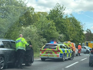 Delays on A31 Hogs Back after car and motorcycle collision