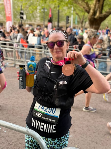 Vivienne Liddell, Deputy Head at Highfield and Brookham School, after completing the London Marathon in aid of the Highreach programme, proudly wearing her finisher’s medal. Credit: Highfield and Brookham School