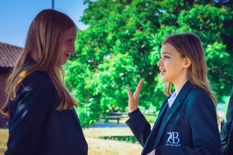 Students from Bohunt School celebrate after achieving a 100 per cent distinction rate in their LAMDA exams. Credit: Bohunt School