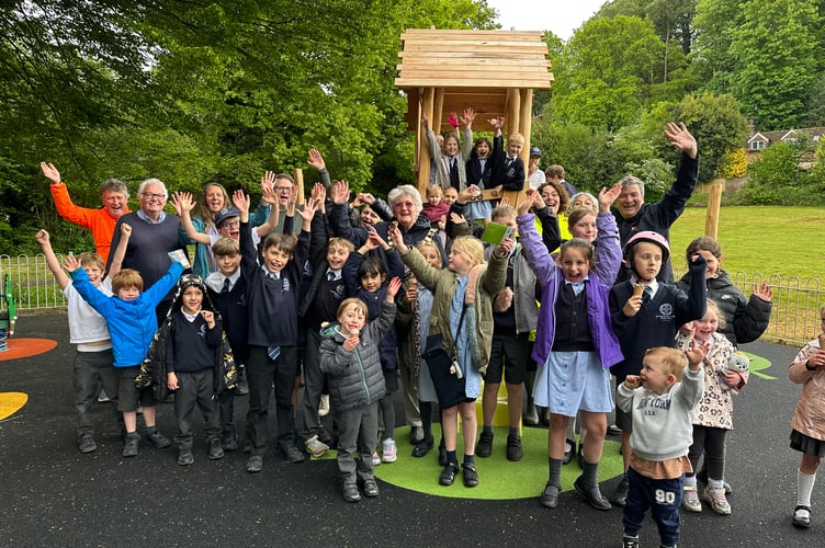 Councillors, Mayor Jean Arrick and families come together in Meadow Town Park for the official opening of the £130,000 playground redevelopment.