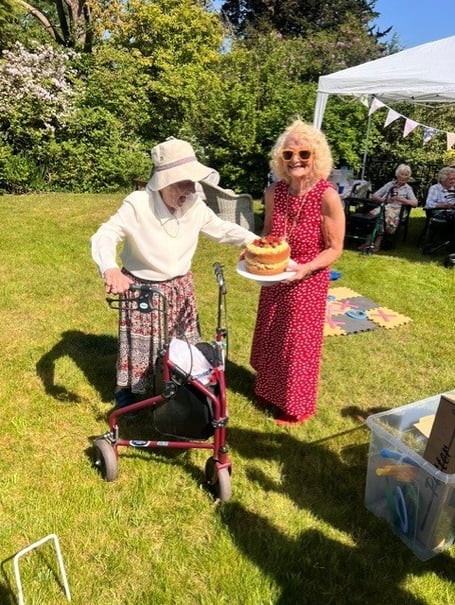 Joyce Douglas, 101, celebrates her milestone birthday at Redcot care home in Haslemere with family, friends and staff from Friends of the Elderly.