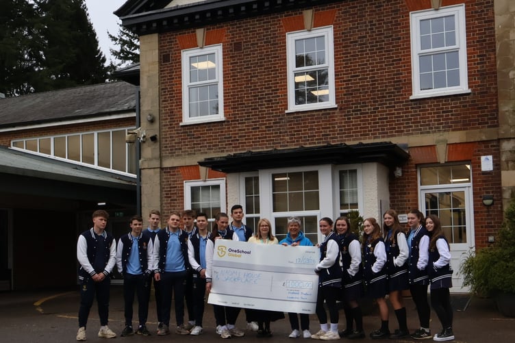 Students from OneSchool Global Hindhead Campus present a £1,000 cheque to Naomi and Jack's representative Jackie Benn after raising funds through a series of school fundraising events. Credit: OneSchool Global Hindhead Campus