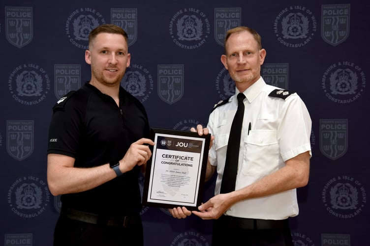 Hamphire Police Sergeant James Hall receives his award from Chief Superintendent Simon Dodds.