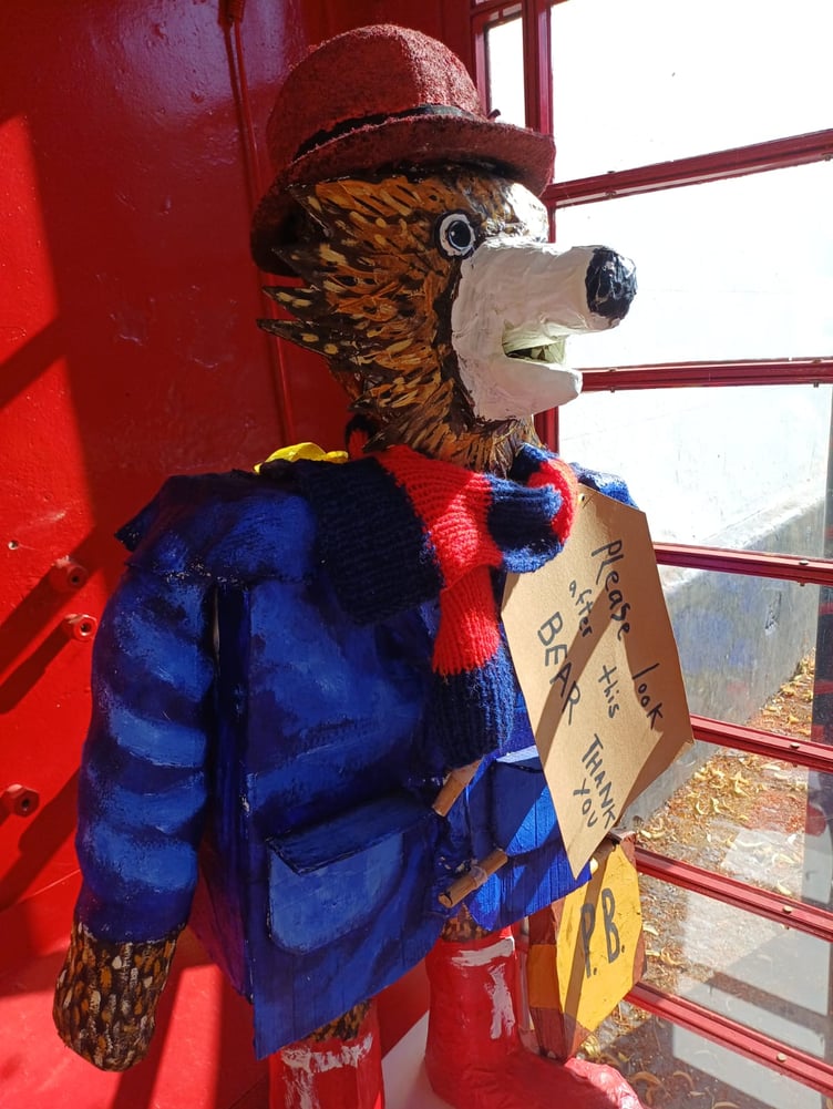 The Paddington bear model in a phone box in Farnham.