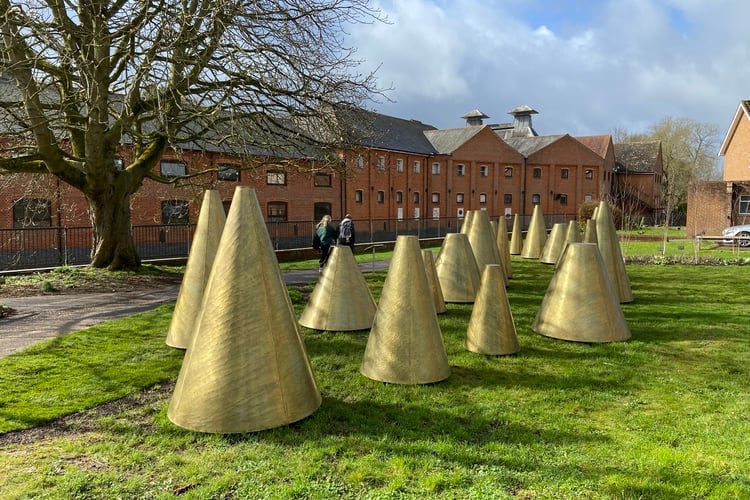 A Hand's Turn Riverside golden cones sculpture