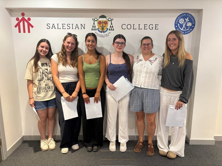 Farnborough Salesian College girls celebrate their A-Level results.
