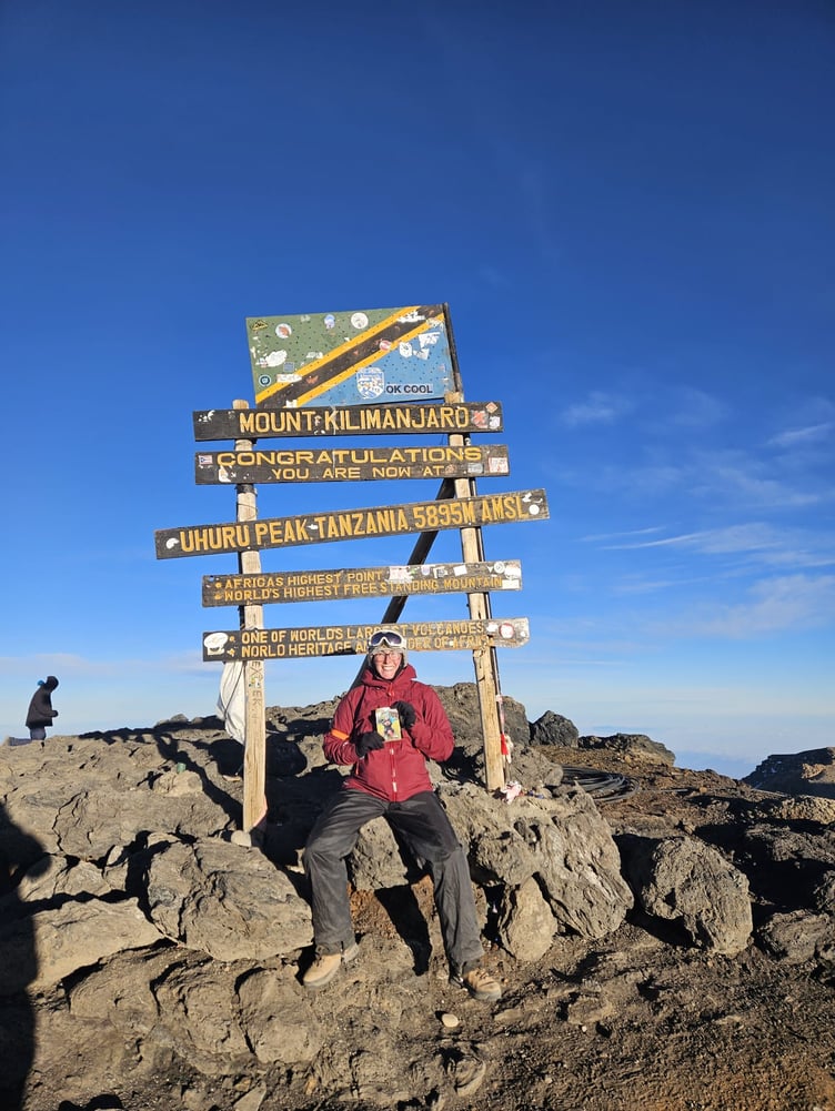 Harley Cunningham of Horsell at the summit of Kilimanjaro.
