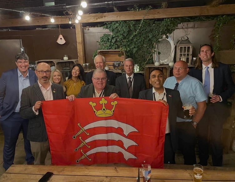 West Surrey councillors celebrate the vote to rename the shadow authority West Surrey and South Middlesex Council in July.